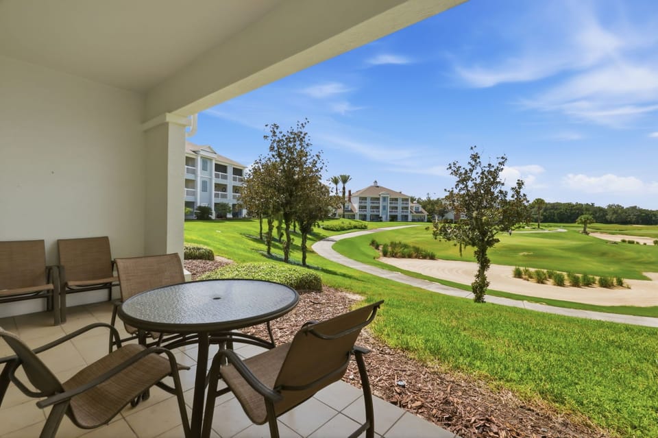 One of the condo’s best features: wide, unobstructed golf-course views from your own covered outdoor space.