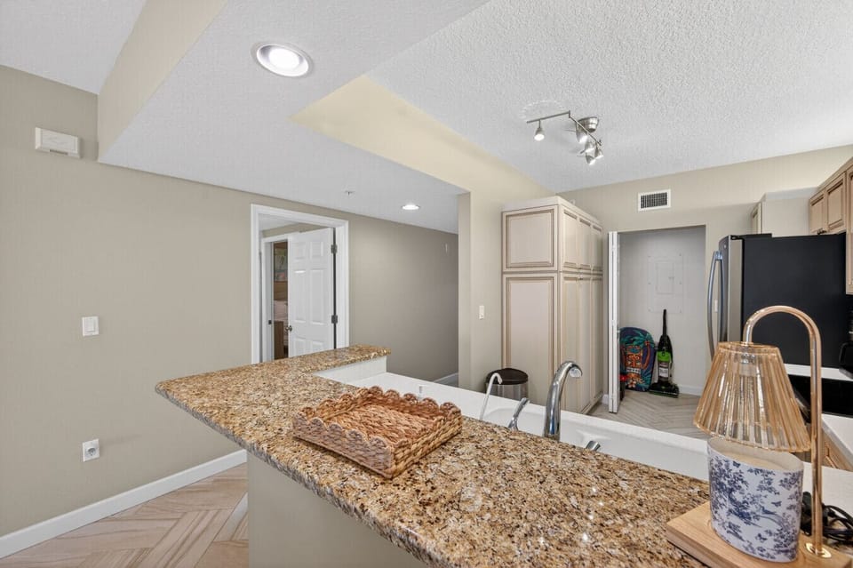 Kitchen counter view w/ bar seating, perfect for casual meals or morning coffee.