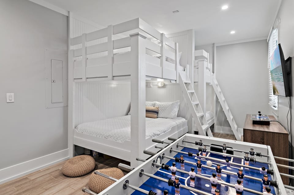 1st Floor - Bedroom 5: BUNK ROOM with Queen/Queen Bunk, Full/Full Bunk, Arcade Game, Foosball Table, Smart TV + Game Console with pre-loaded games (Sleeps 6-8)