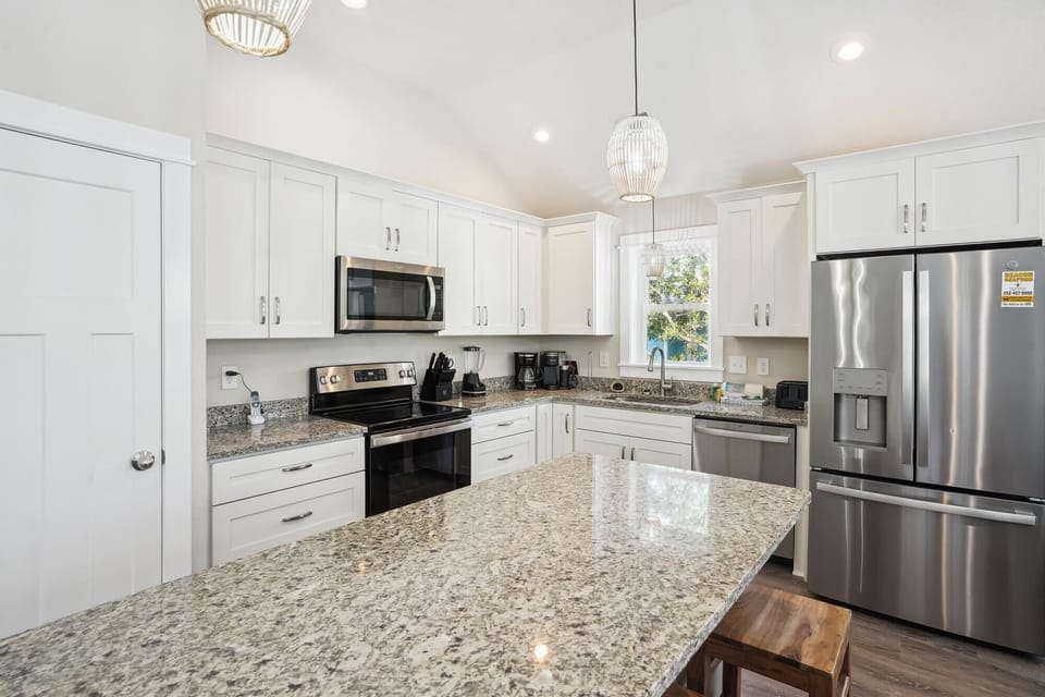 Fully equipped kitchen with granite countertops and stainless steel appliances