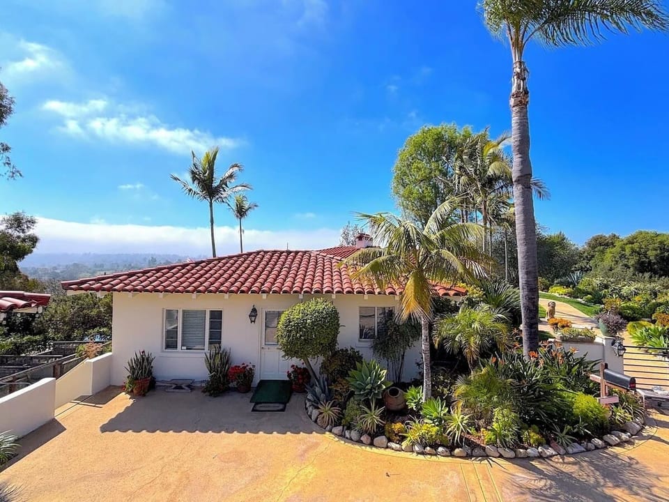 Cozy retreat with stunning views, serene gardens & shared pool.