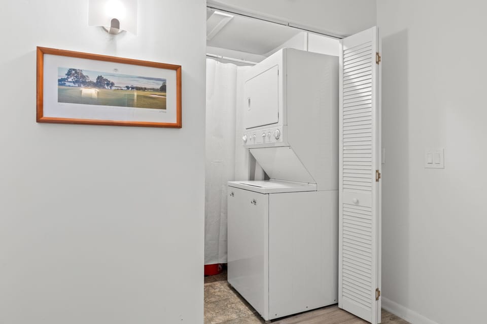 Stackable laundry facility tucked away bu the front of the villa