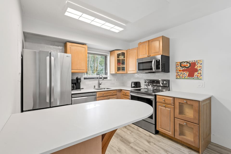 Light bright and open kitchen that is fully stocked