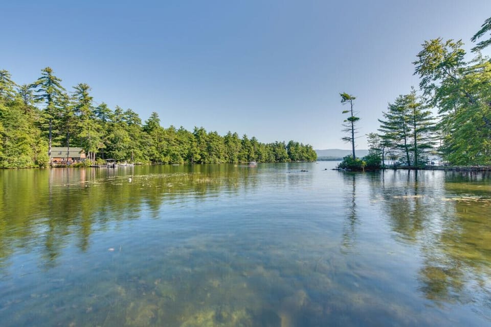 Beautiful open lake view with calm waters and trees