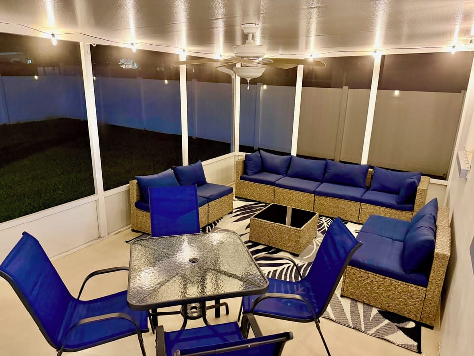Screened lanai with conversational set & table/chairs 