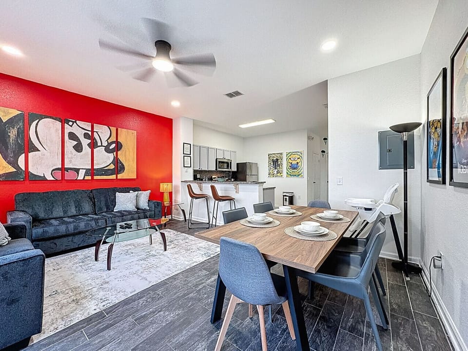 Stylish Living & Dining Area — Open-concept space with comfortable seating, dining table, and fully equipped kitchen, perfect for relaxing together.