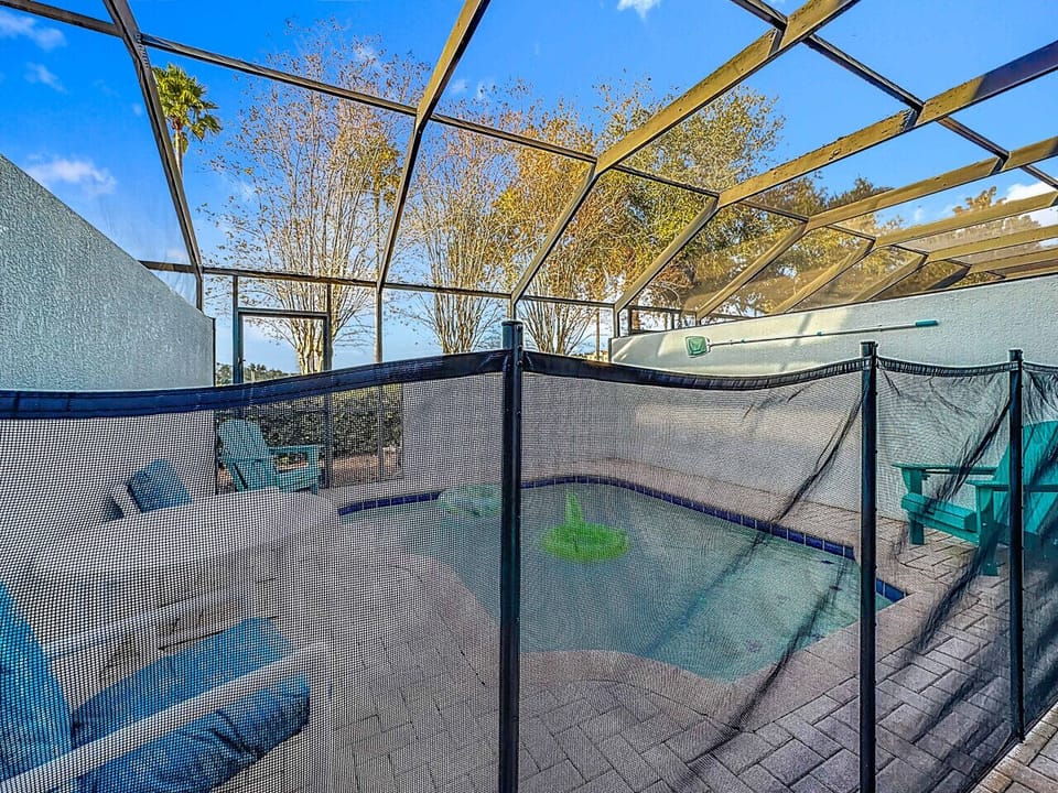 Fully screened pool area with safety fencing and seating