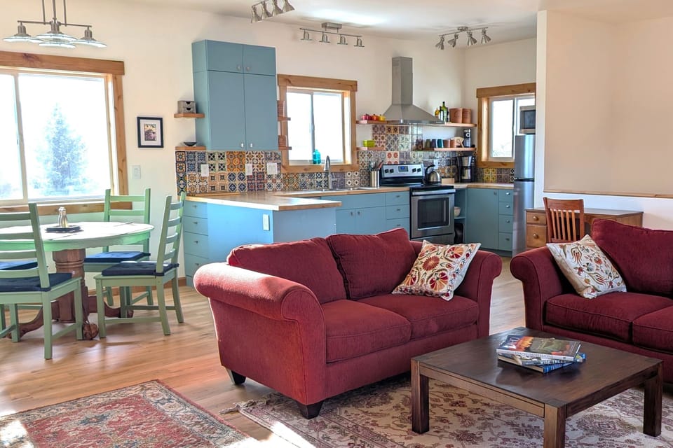 The open living space is uncluttered and serene, but full of color.