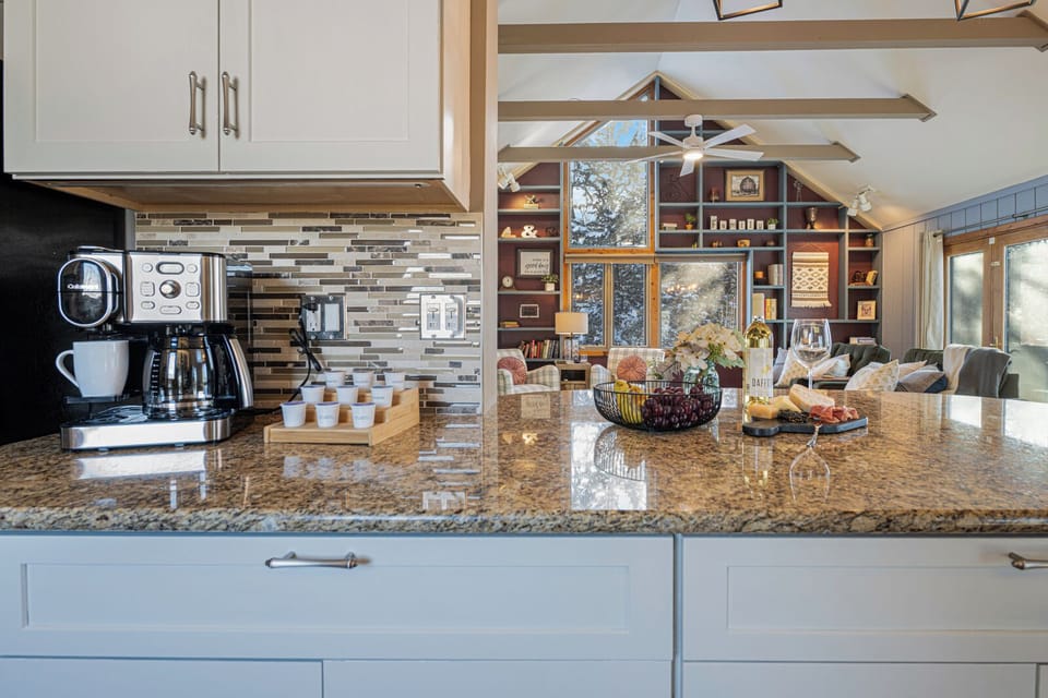 The kitchen island anchors the home, perfect for morning coffee / evening snacks