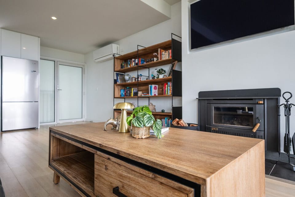 Relax by the Coonara fireplace in the generous living space. Cosy wood fire — 15kg of firewood included per stay