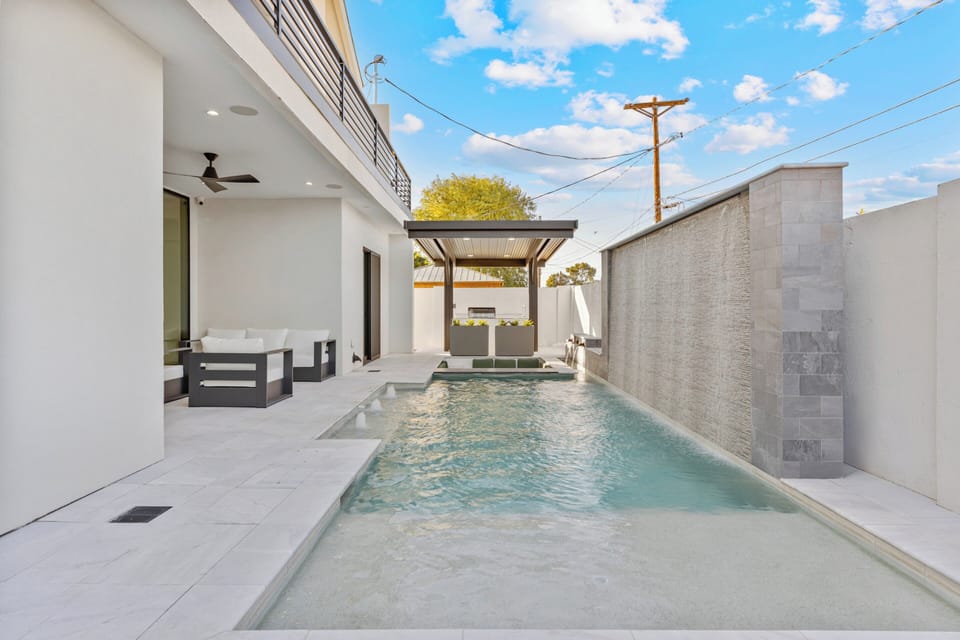 Pool with Sun Shelf and Covered Patio Seating