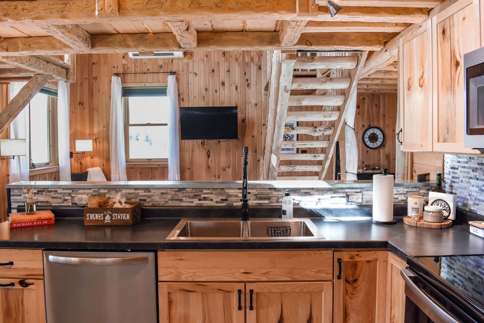 Open concept kitchen and living room create a welcoming space for everyone.