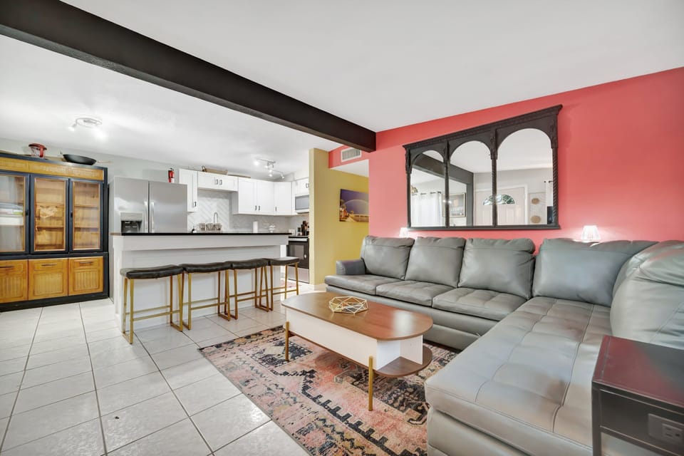 Open-concept living with fully equipped kitchen and cozy lounge seating