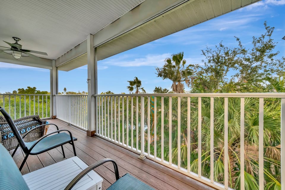 Covered balcony with tropical views and coastal breezes