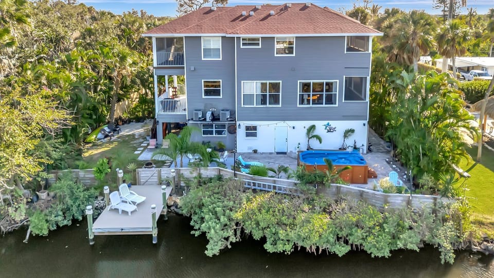 Your own waterfront escape with dock and tropical surroundings