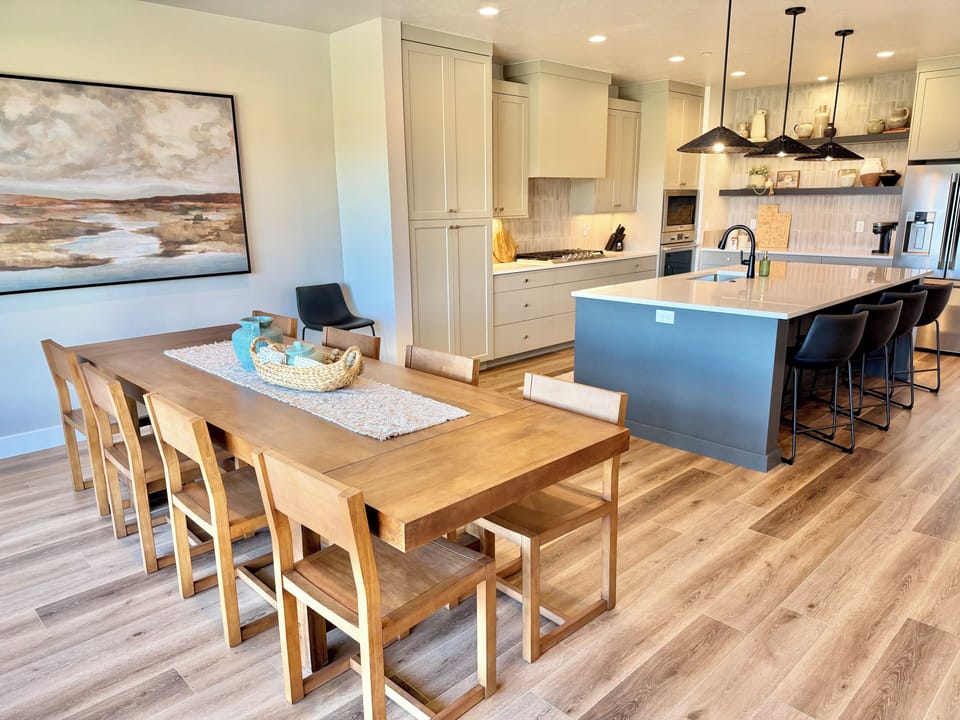 Indoor dining for 8 plus 5 more at the island, and outdoor picnic dining for 12.