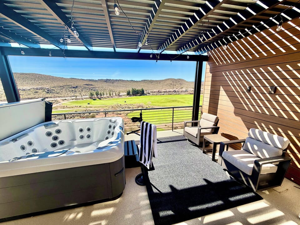 Upstairs deck with hot tub, killer view, and automatic night-time string lights.
