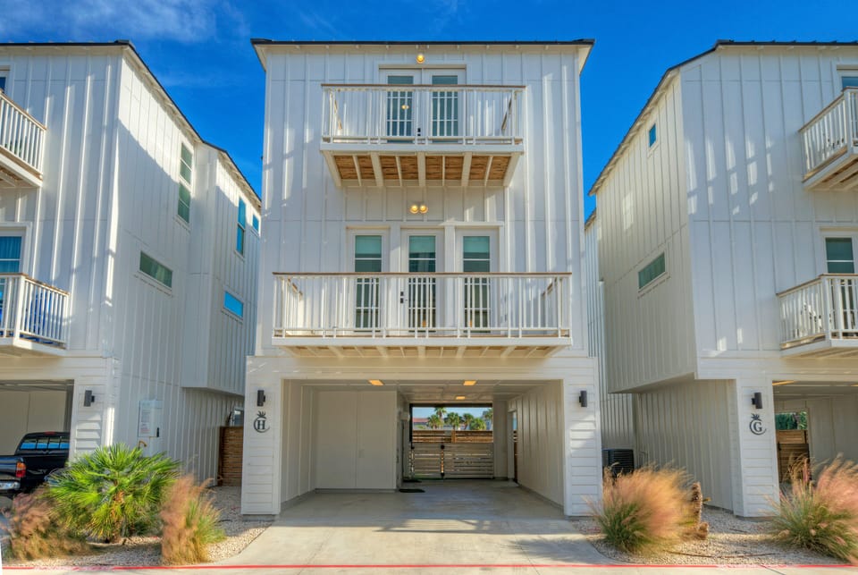Modern three-story coastal home exterior.