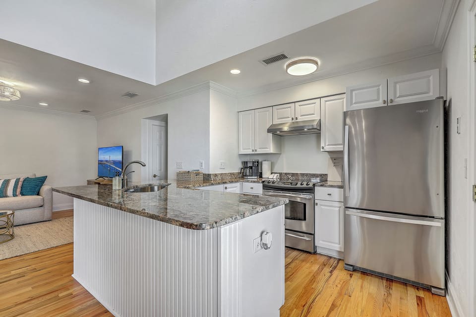 Bask in abundant natural light streaming through the impressive vaulted ceiling while you prepare meals.