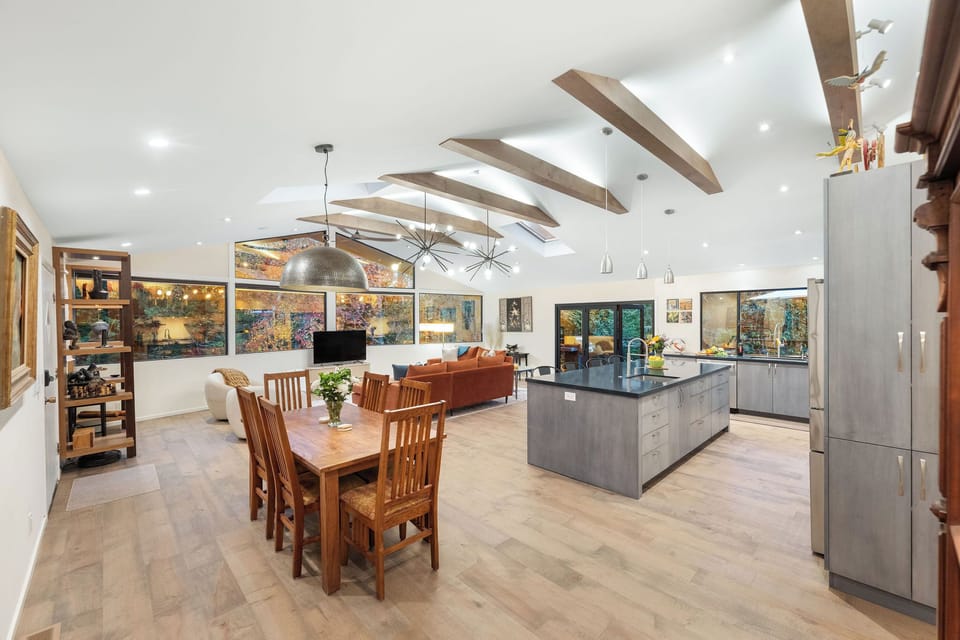 Your spacious open-plan living area combines kitchen, dining and lounge with soaring beams and garden views for memorable gatherings.