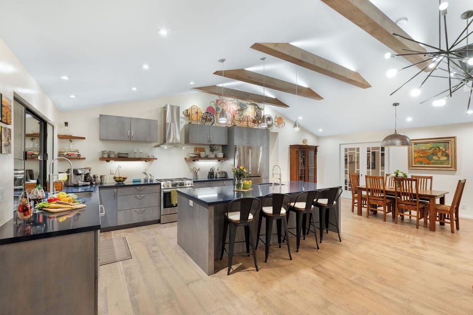 Your gourmet kitchen features sleek granite countertops, professional appliances, and a spacious island perfect for cooking memorable meals together.