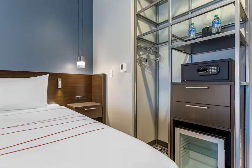 Store luggage neatly and enjoy convenient bedside charging access.
