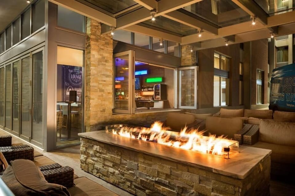Unwind by the glowing fire pit under cozy evening lights.