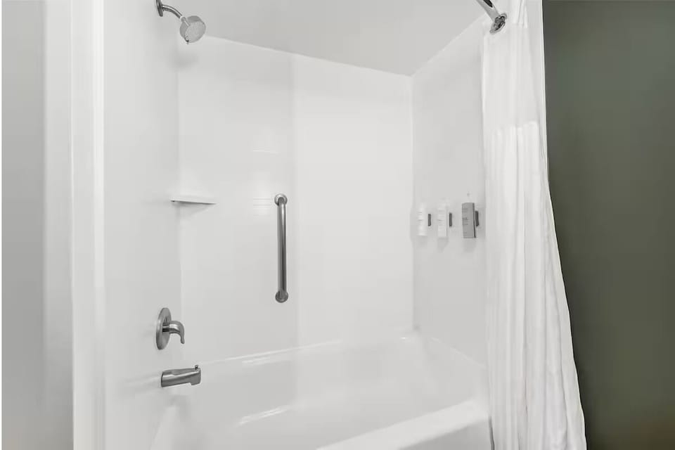 Refresh with a clean tub shower and bright, simple finish.