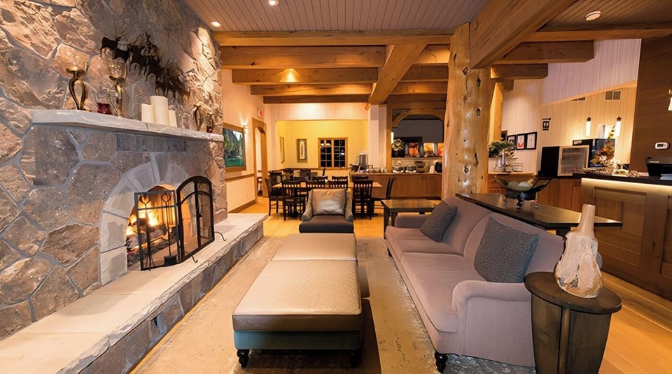 Unwind by the glowing stone fireplace after a mountain day.