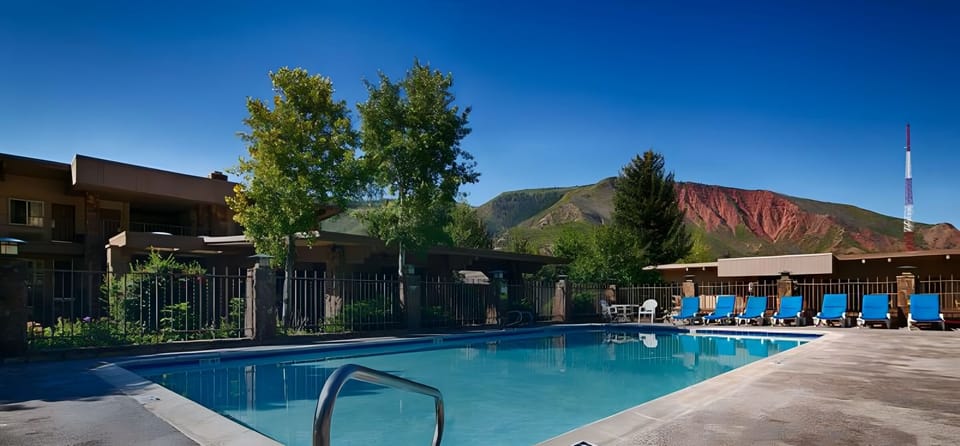Cool off in the sparkling pool under clear blue skies.