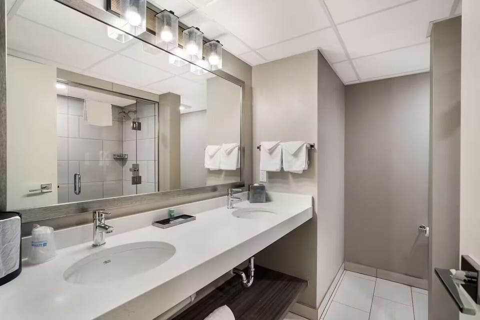 Get ready easily with double sinks and bright vanity lighting.