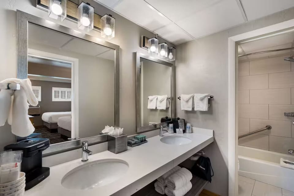 Refresh at the double vanity with bright, modern lighting.