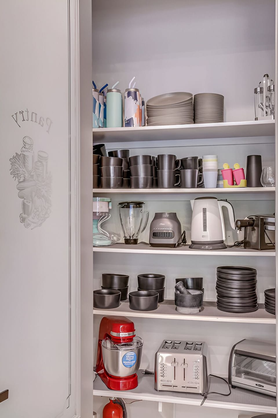Fully stocked kitchen essentials, with plenty of dishes, drinkware, and appliances for convenient meals and entertaining.