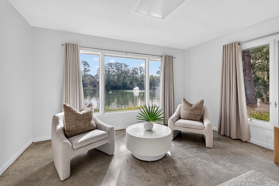 The Jekyll suite on main floor offers a king bed, sitting area & pond view.