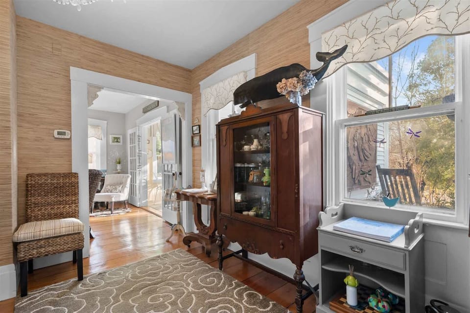 Open hallway connecting living, dining, and kitchen spaces, keeping everyone together in this spacious Centerville Cape Cod rental.