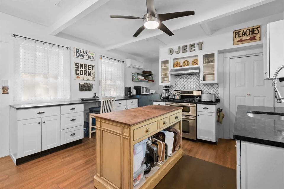 Fully equipped kitchen with modern appliances and storage, ready for cooking and entertaining in your Centerville Cape Cod vacation rental.