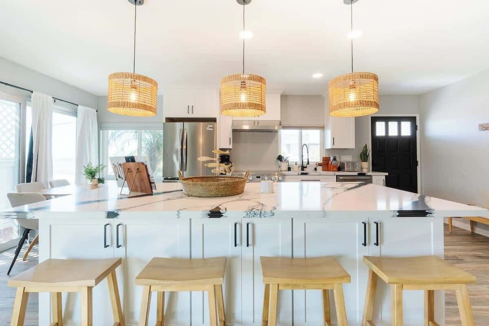 Sit up at the sleek stone breakfast bar and keep the chef company 