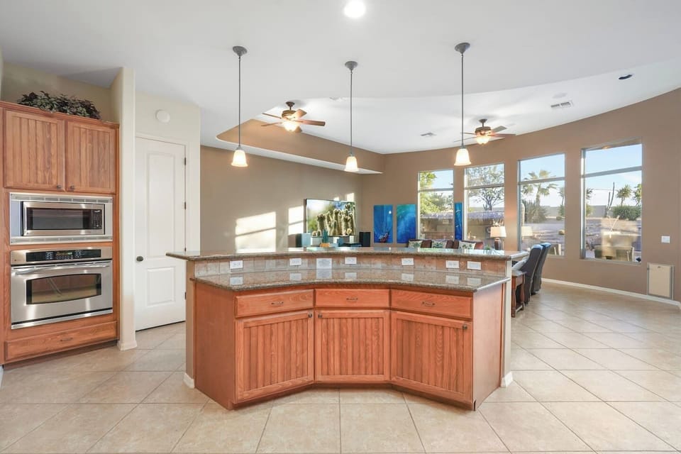 Large breakfast bar connecting the kitchen to the open living area.