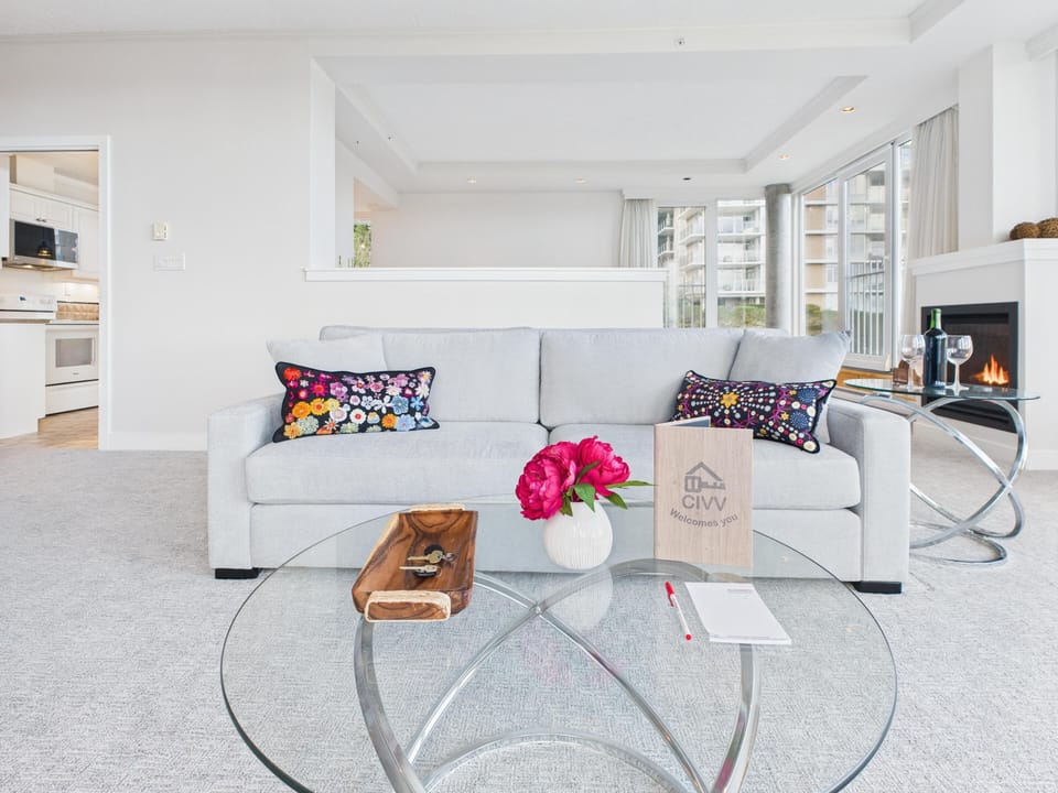 Bright, airy living space with designer finishes and sofa bed..
