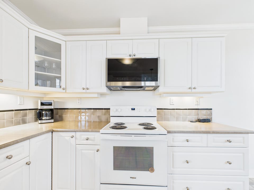 Chef-inspired kitchen with sleek granite countertops.