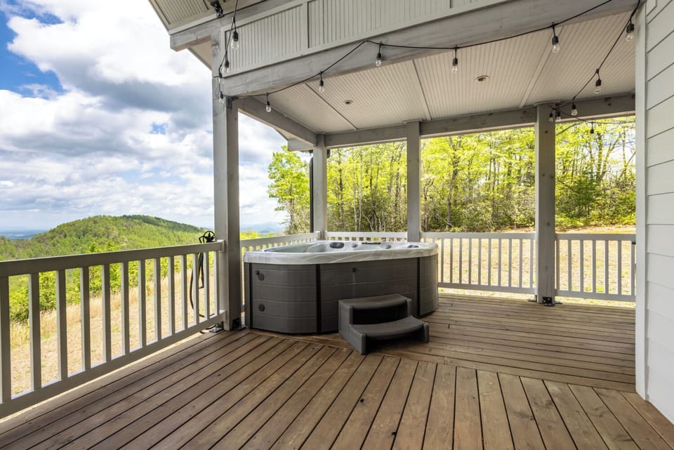 Enjoy the hot tub with a stunning view of the mountains
