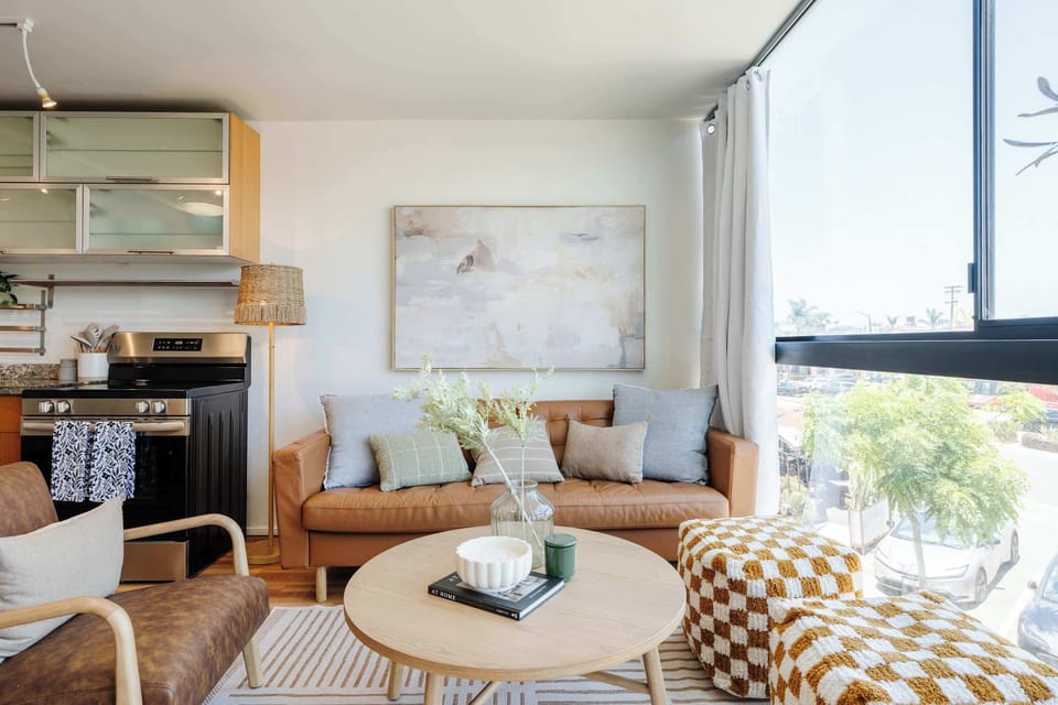 Unwind after a day out on the cozy couch with views of tree-lined streets through oversized windows.
