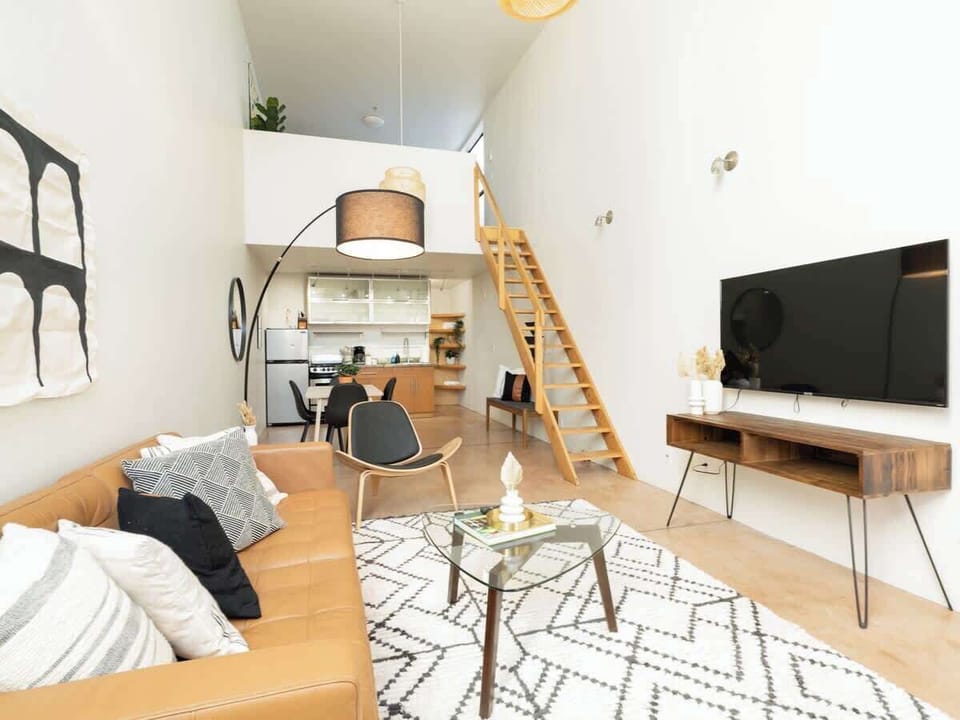 Gather your loved ones in this stylish living area, designed for comfort and connection.
