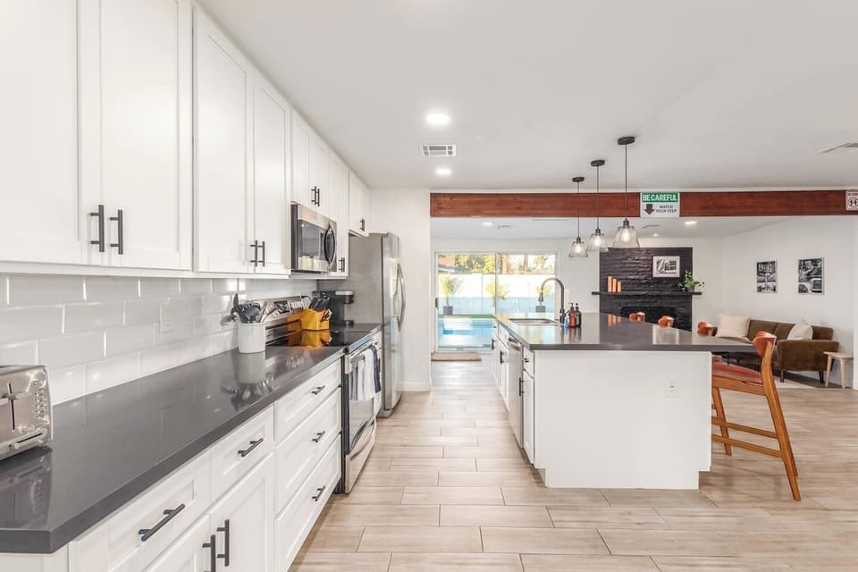 Full kitchen with stainless appliances and prep space