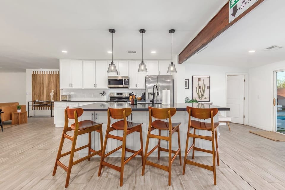 Gather with your loved ones around the spacious island, share meals, stories, and create lasting memories in this bright, modern kitchen.