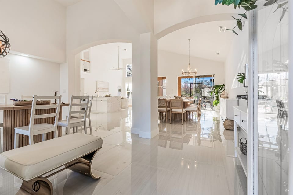 Grand entry into an open-concept floor plan filled with natural light and easy flow