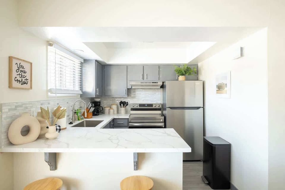 Sit up at the sleek stone breakfast bar with your morning coffee