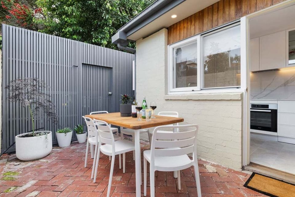 COURTYARD: The sunny courtyard has an outdoor table setting that seats six that is perfect for al fresco dining and entertaining.