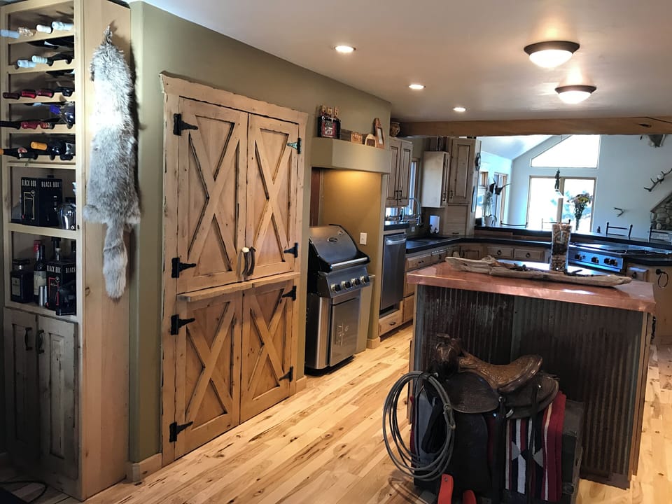 Fireplace wall has been painted Black.