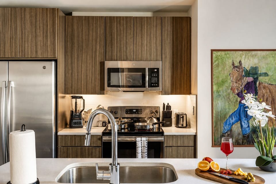 Modern kitchen with stainless appliances and stylish island workspace